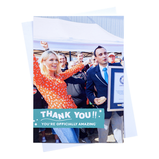 an a5 portrait thank you post card with a holding image of someone celebratin their new world record with envelope