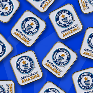 multiple Officially Amazing pin badges scattered across blue background